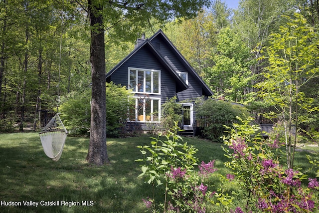 36 Ridgewood Rd, Kerhonkson, NY 12446 - back of house featuring a lawn and a forest view