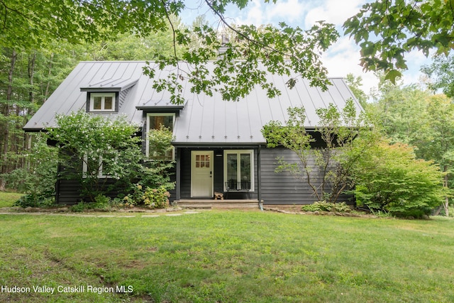 36 Ridgewood Rd, Kerhonkson, NY 12446 - view of front of house featuring a standing seam roof, a front yard, and metal roof
