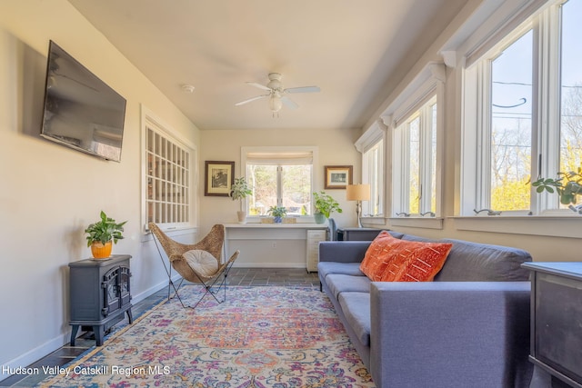 sunroom / solarium featuring a wood stove