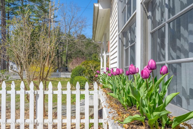 view of side of property featuring fence
