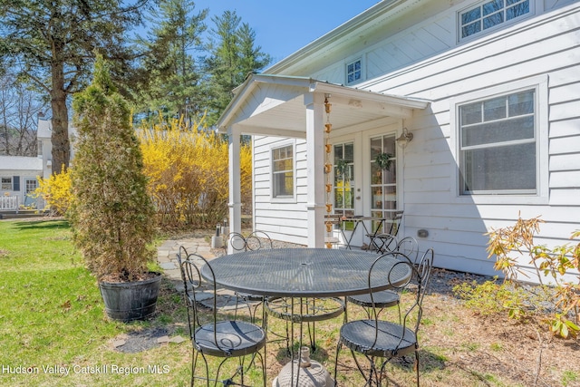 view of patio with outdoor dining area and french doors
