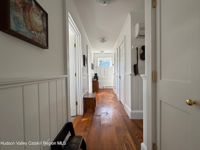 110 County Route 7a, Copake, NY 12516 - hallway with a decorative wall, wood-type flooring, wainscoting, a baseboard heating unit, and crown molding