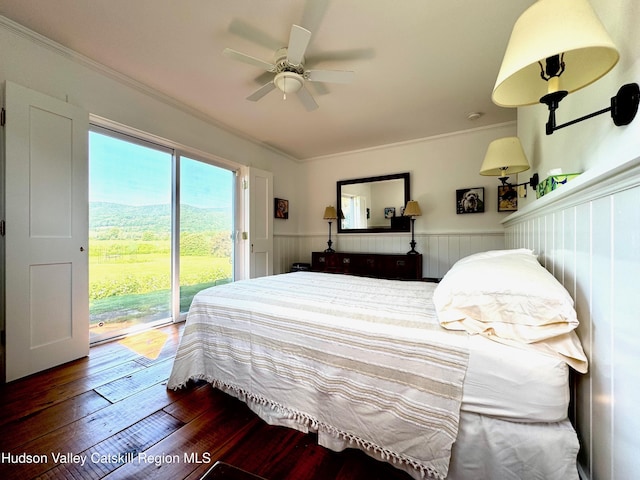 110 County Route 7a, Copake, NY 12516 - bedroom with access to exterior, wainscoting, dark wood-type flooring, crown molding, and a ceiling fan