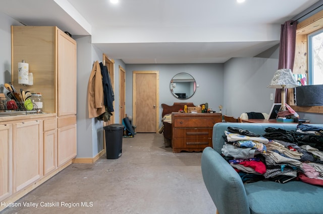 bedroom with concrete floors