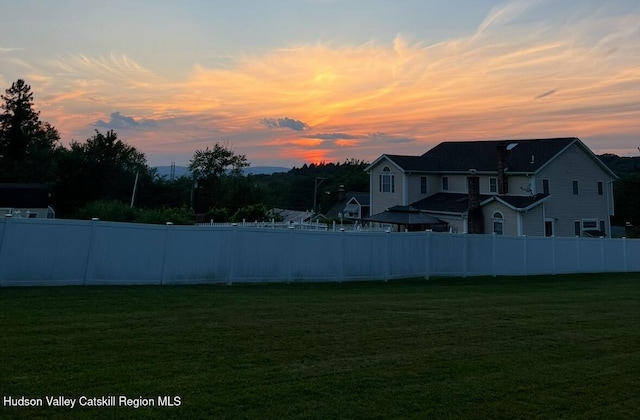 view of yard at dusk