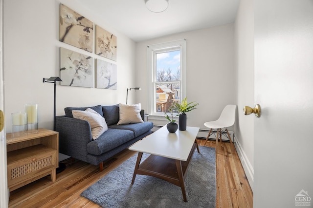 7 Mckinstry Pl, Hudson, NY 12534 - living area featuring wood finished floors, baseboard heating, and baseboards