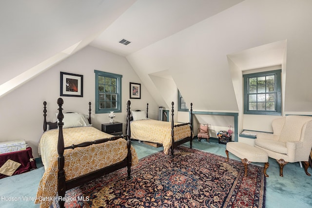 bedroom featuring carpet flooring and vaulted ceiling