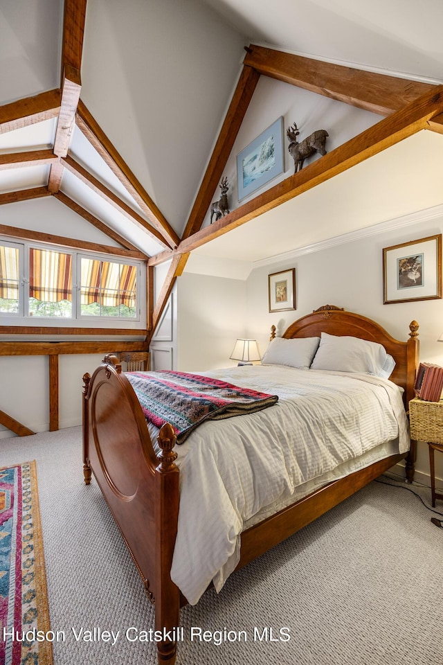 bedroom featuring carpet flooring and vaulted ceiling