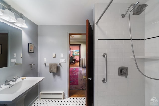 44 Worth Ave, Hudson, NY 12534 - full bathroom featuring a baseboard heating unit, radiator heating unit, a sink, and a tile shower