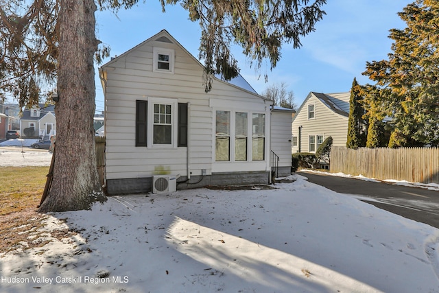 back of house featuring ac unit