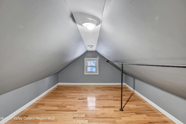 bonus room featuring hardwood / wood-style flooring and lofted ceiling