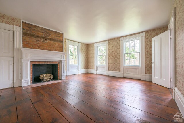 1606 Bulls Head Rd, Stanfordville, NY 12581 - unfurnished living room featuring wallpapered walls, hardwood / wood-style floors, plenty of natural light, and a brick fireplace