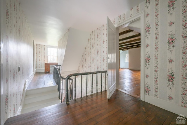 1606 Bulls Head Rd, Stanfordville, NY 12581 - corridor featuring wallpapered walls, healthy amount of natural light, hardwood / wood-style flooring, an upstairs landing, and beam ceiling