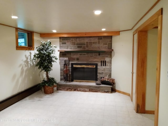 living room with a stone fireplace