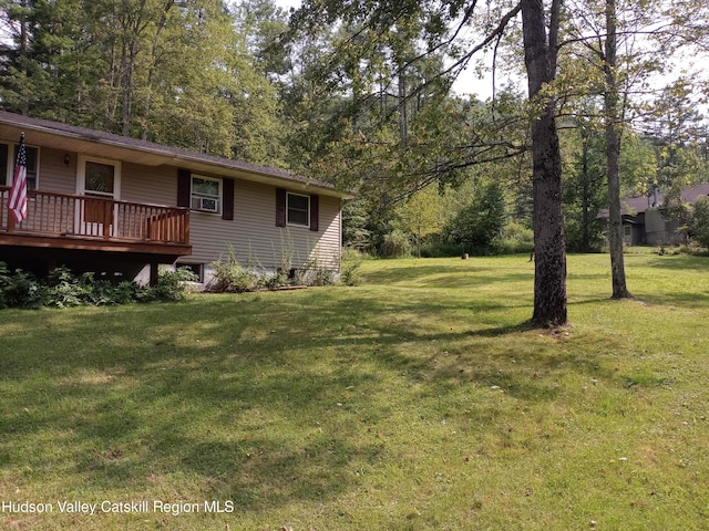 view of yard featuring a wooden deck