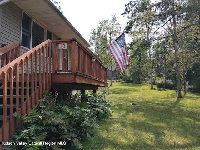 view of yard featuring a wooden deck