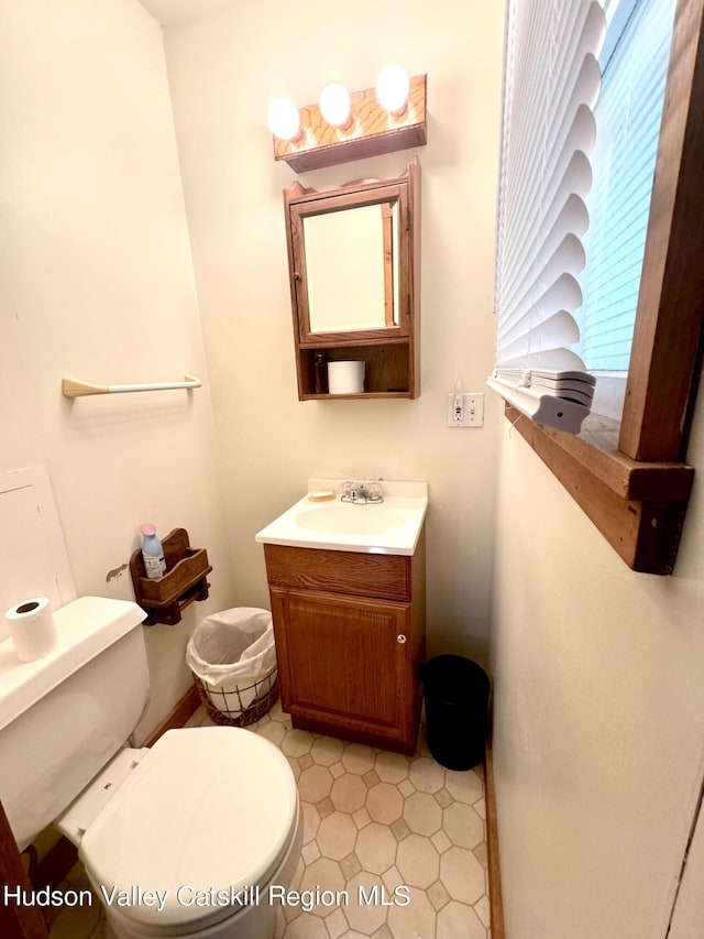 bathroom with vanity and toilet