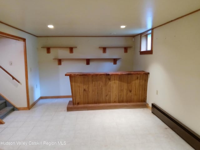 kitchen with kitchen peninsula and a baseboard radiator