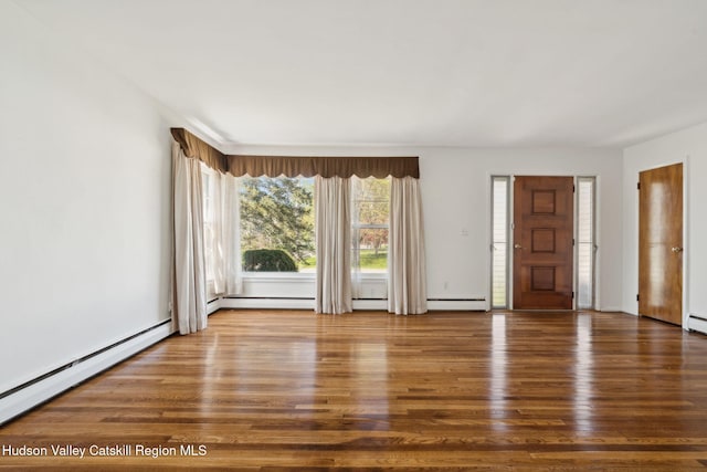 4 Schuler Ln, Lake Katrine, NY 12449 - unfurnished living room featuring wood finished floors, a baseboard radiator, and baseboard heating