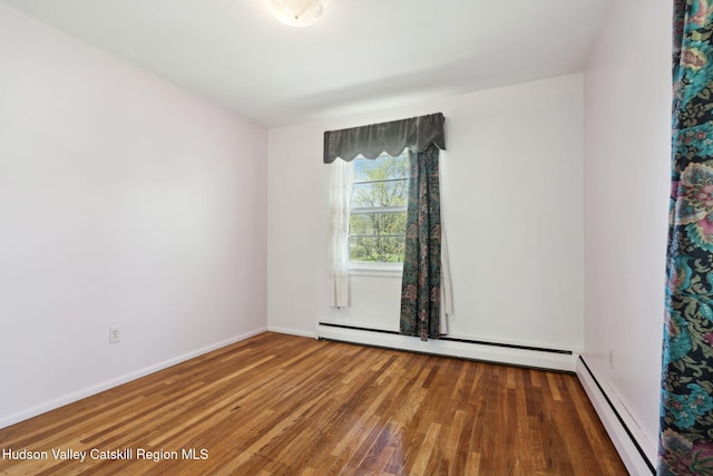 4 Schuler Ln, Lake Katrine, NY 12449 - empty room with a baseboard radiator, wood finished floors, and baseboards