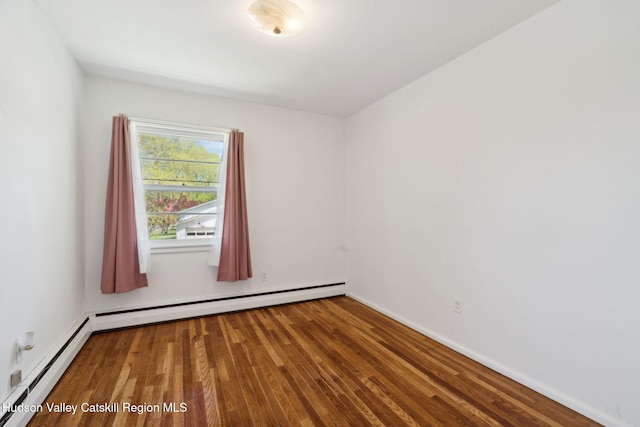 4 Schuler Ln, Lake Katrine, NY 12449 - unfurnished room featuring baseboard heating, wood finished floors, and baseboards