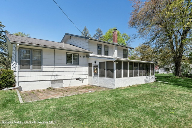 4 Schuler Ln, Lake Katrine, NY 12449 - rear view of property featuring a sunroom, a chimney, and a yard