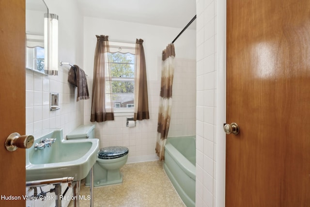 4 Schuler Ln, Lake Katrine, NY 12449 - full bath with tile walls, toilet, a sink, and shower / bath combo with shower curtain