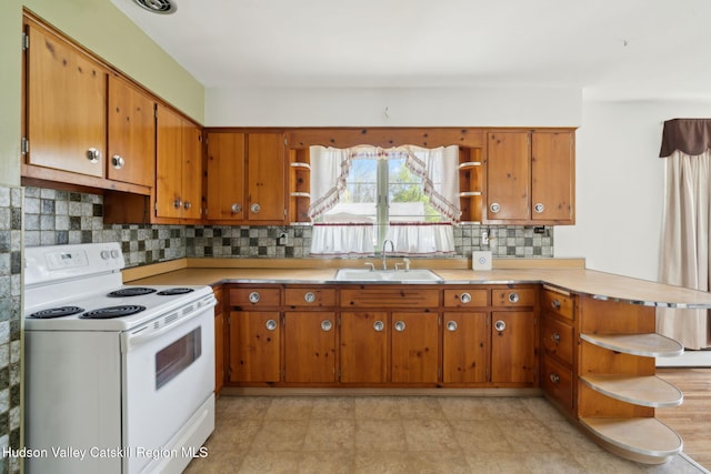 4 Schuler Ln, Lake Katrine, NY 12449 - kitchen featuring open shelves, white electric stove, a sink, a peninsula, and brown cabinets