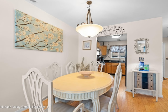 dining area featuring light hardwood / wood-style flooring