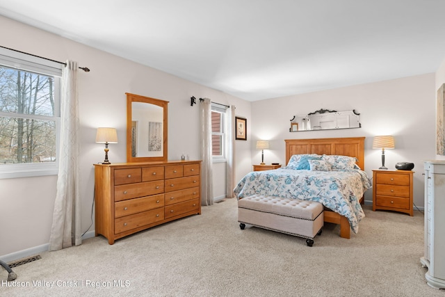 bedroom with light colored carpet