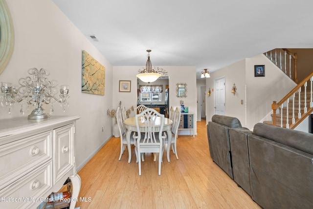 dining room with light wood-type flooring