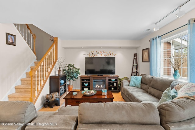 living room featuring rail lighting