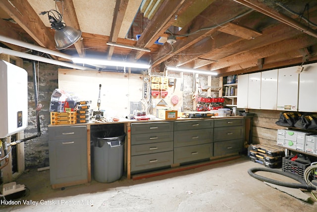 unfinished basement with a workshop area