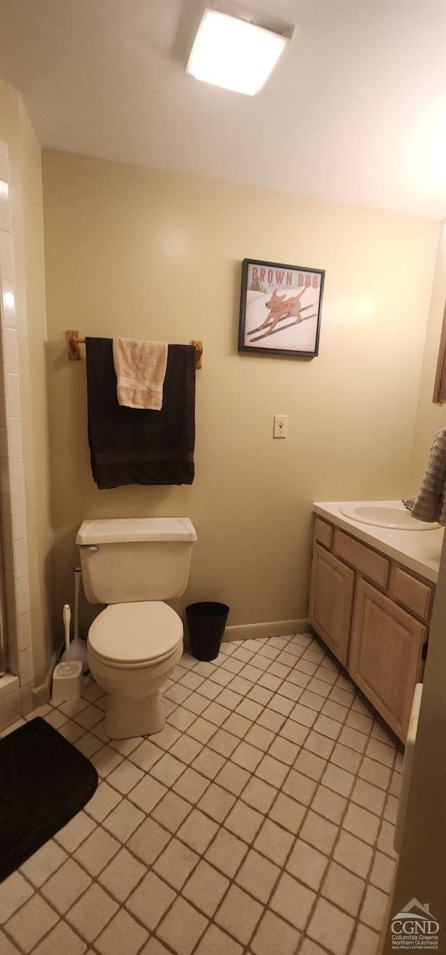274 N Brooksburg Rd Unit 35, Windham, NY 12496 - full bathroom with tile patterned flooring, toilet, vanity, baseboards, and a shower