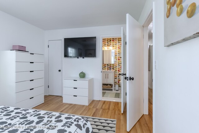 331 Joys Ln, Hurley, NY 12443 - bedroom with light wood finished floors and ensuite bath