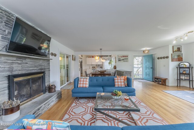 331 Joys Ln, Hurley, NY 12443 - living room featuring wood finished floors and a fireplace
