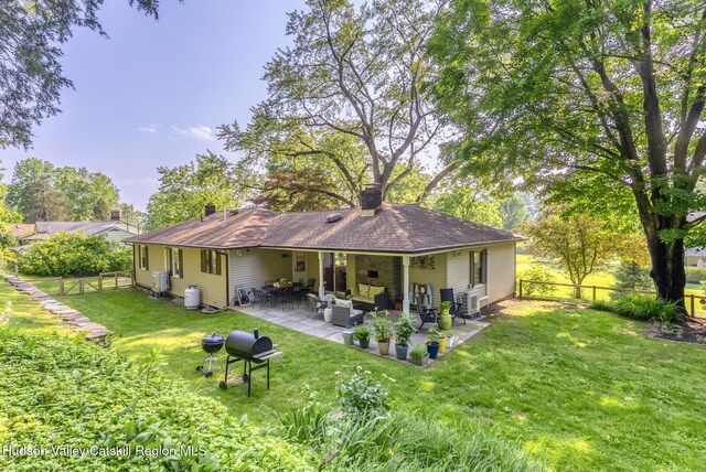 331 Joys Ln, Hurley, NY 12443 - rear view of house with an outdoor hangout area, a patio, a fenced backyard, and a chimney