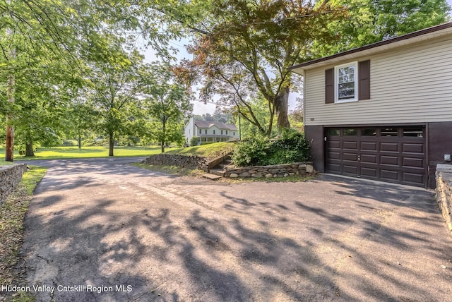 331 Joys Ln, Hurley, NY 12443 - view of side of home featuring asphalt driveway and an attached garage