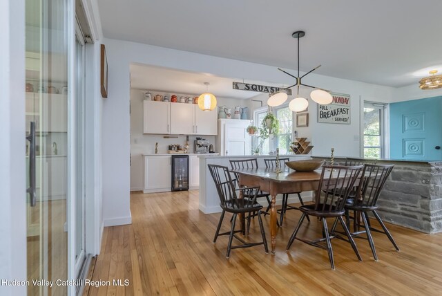 331 Joys Ln, Hurley, NY 12443 - dining room with beverage cooler and light wood-style flooring