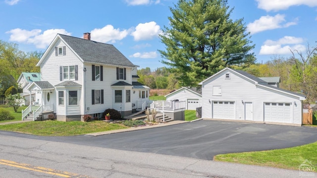 470 W Main St, Catskill, NY 12414 - view of home's exterior with an outdoor structure, a chimney, a garage, and driveway