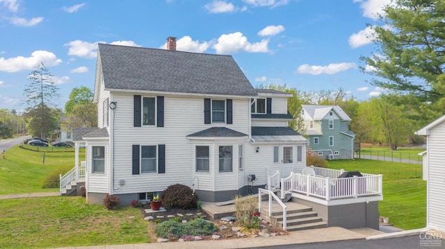 470 W Main St, Catskill, NY 12414 - view of front of home featuring a chimney, a front yard, roof with shingles, and a deck
