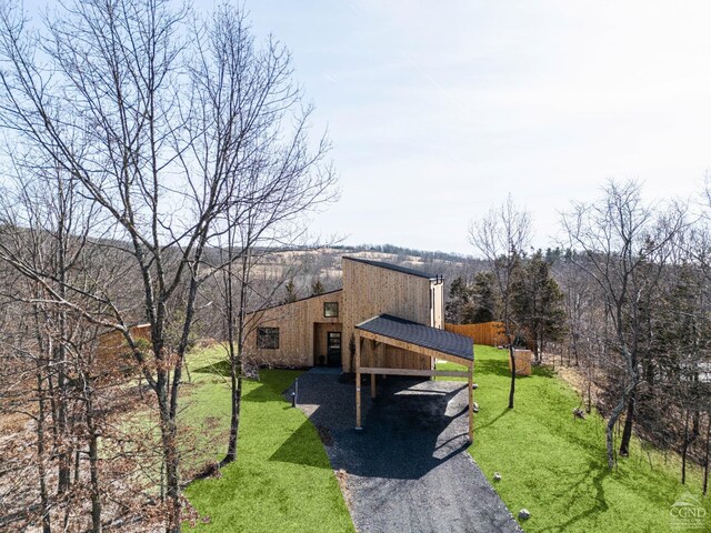 998 Willow Brook Rd, Milan, NY 12514 - view of property exterior with a lawn, asphalt driveway, and a carport
