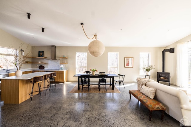 998 Willow Brook Rd, Milan, NY 12514 - dining room with a wood stove