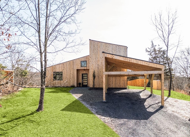 998 Willow Brook Rd, Milan, NY 12514 - view of home's community with a carport, a yard, gravel driveway, and an outdoor structure