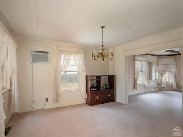 16 Oakwood Blvd, Hudson, NY 12534 - unfurnished living room featuring a chandelier, a wall mounted AC, carpet, and baseboards