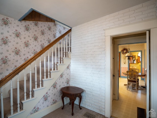 16 Oakwood Blvd, Hudson, NY 12534 - staircase featuring wallpapered walls and brick wall