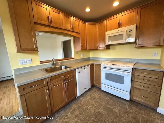 kitchen with sink and white appliances