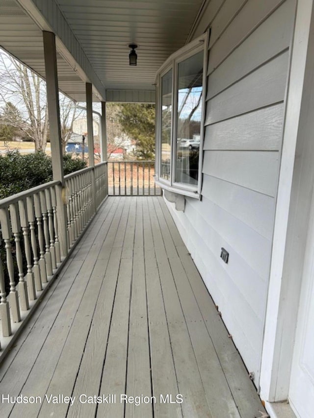 wooden deck featuring a porch