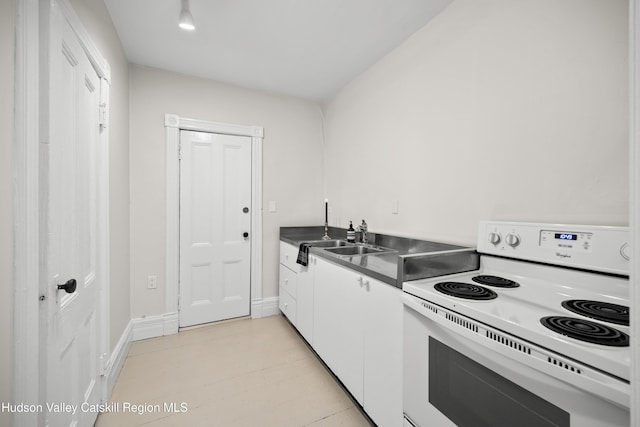356 Warren St, Hudson, NY 12534 - kitchen featuring white electric range oven, white cabinetry, and dark countertops