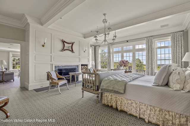 147 Moadock Rd, Millerton, NY 12546 - carpeted bedroom with a decorative wall, crown molding, a fireplace, and beam ceiling